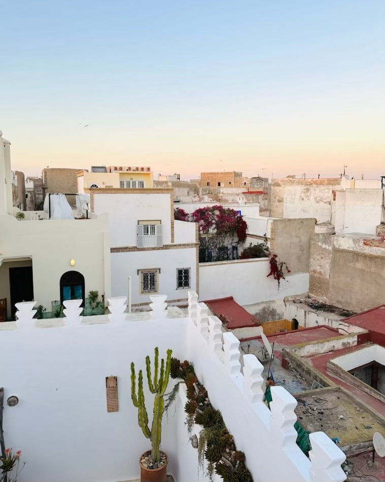 An early sunset view over Essaouira, Morocco from a rooftop terrace.