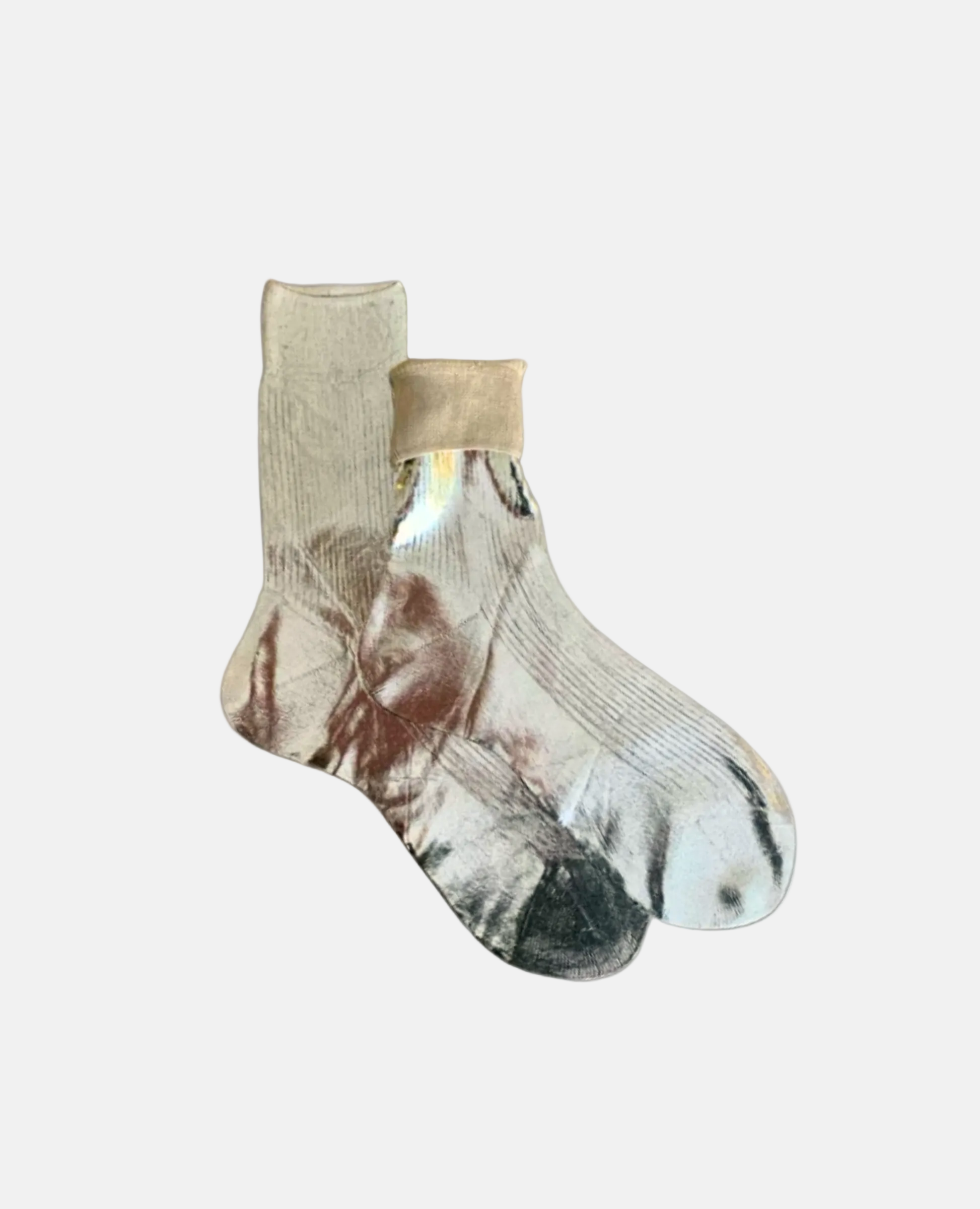 A pair of mid-calf socks featuring a unique, abstract design with a mix of beige, white, and dark gray colors, made from a soft, stretchy fabric with a smooth texture and ribbed cuffs.