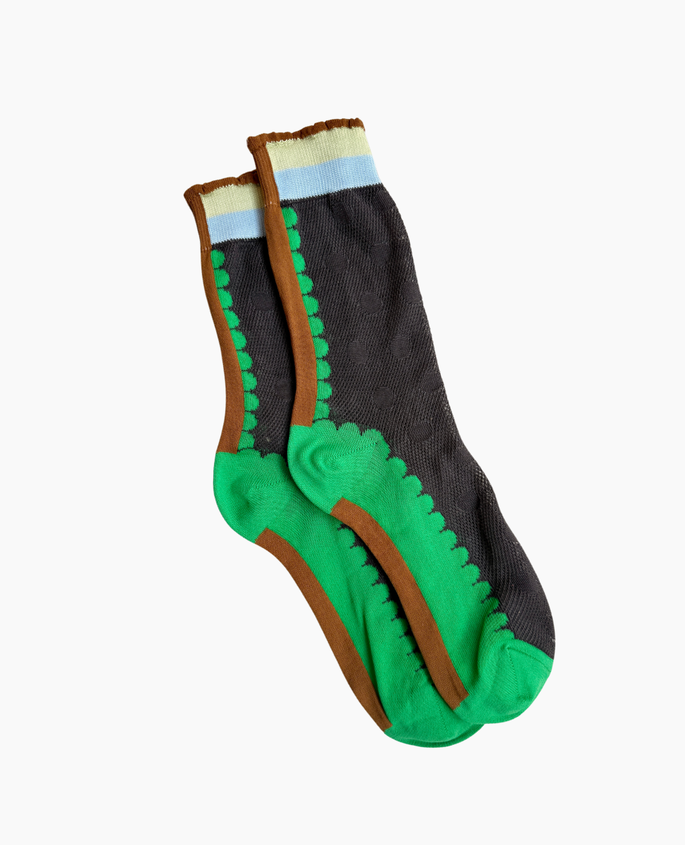 A pair of mid-calf socks featuring a dark gray base with bright green soles and toes, accented by brown and green wavy stripes along the sides, and topped with a light blue and cream band at the cuff.