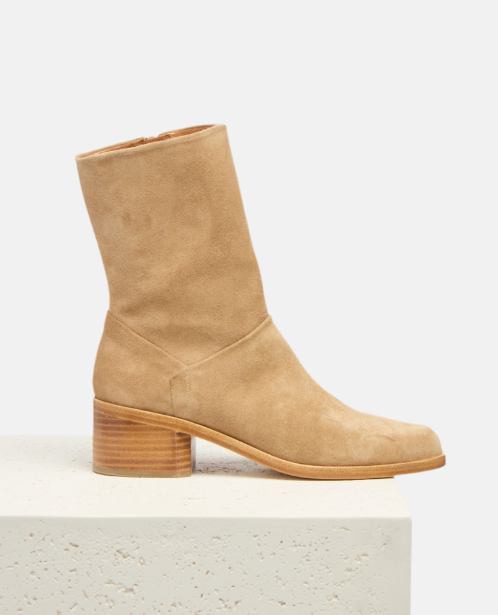 Tan ankle boot on a white background