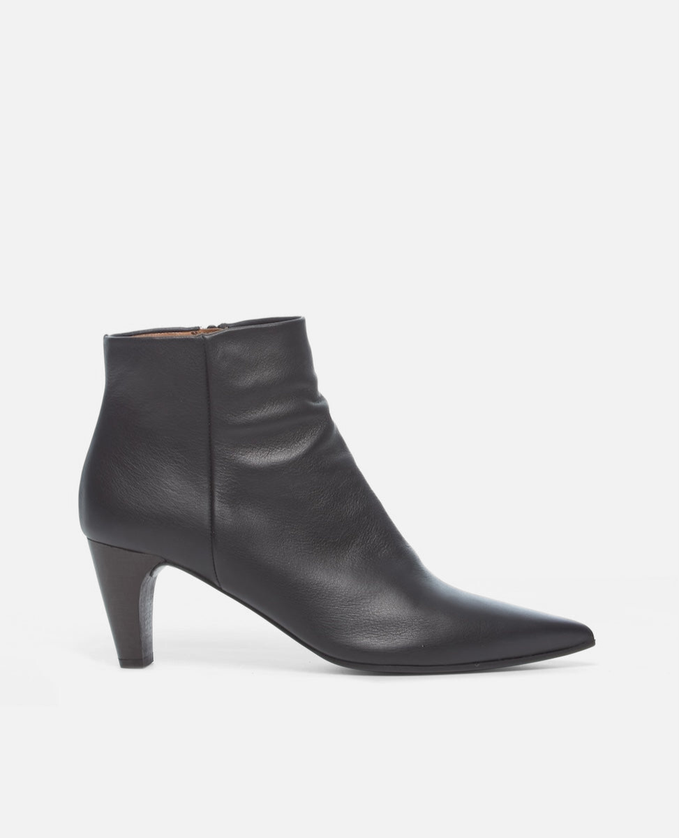 Black leather ankle boot on a white background