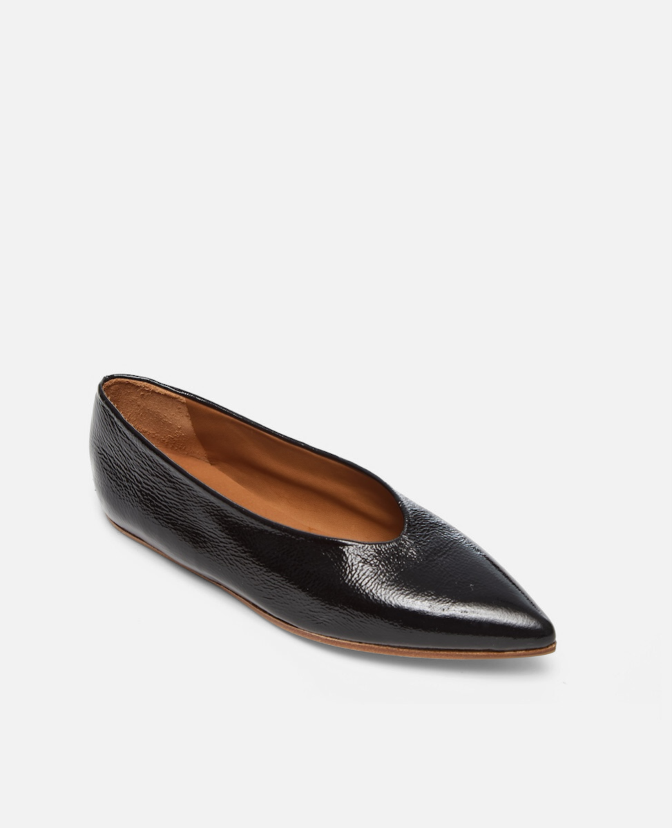 Black pointed-toe flat shoe on a white background