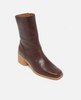 Brown leather ankle boot on a light gray background 2