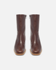 Pair of brown leather boots on a white background 3