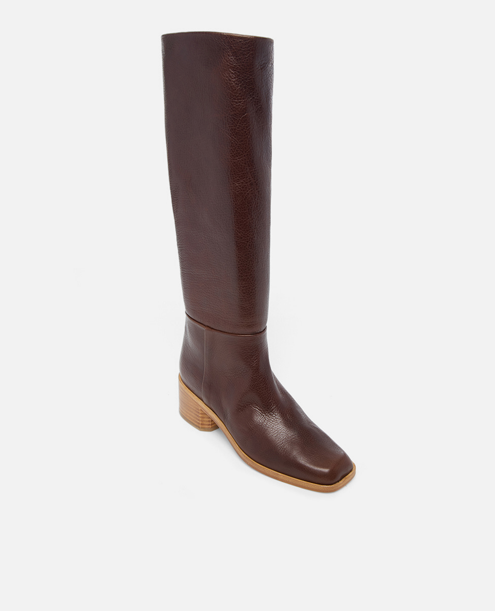 Brown knee-high boot on a light gray background