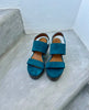 Oca Clog in Azure on a step, seen from the front 7