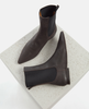 Pair of brown leather ankle boots on a textured white platform 5
