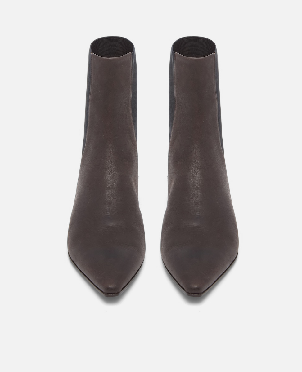 Pair of brown leather ankle boots on a white background