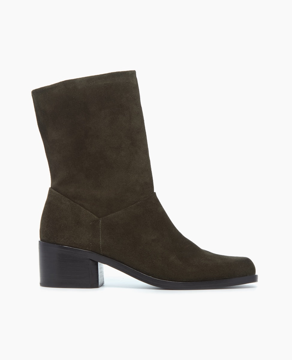 A mid-calf, dark olive green suede boot with a slightly pointed toe, a low block heel, and a smooth, matte finish.