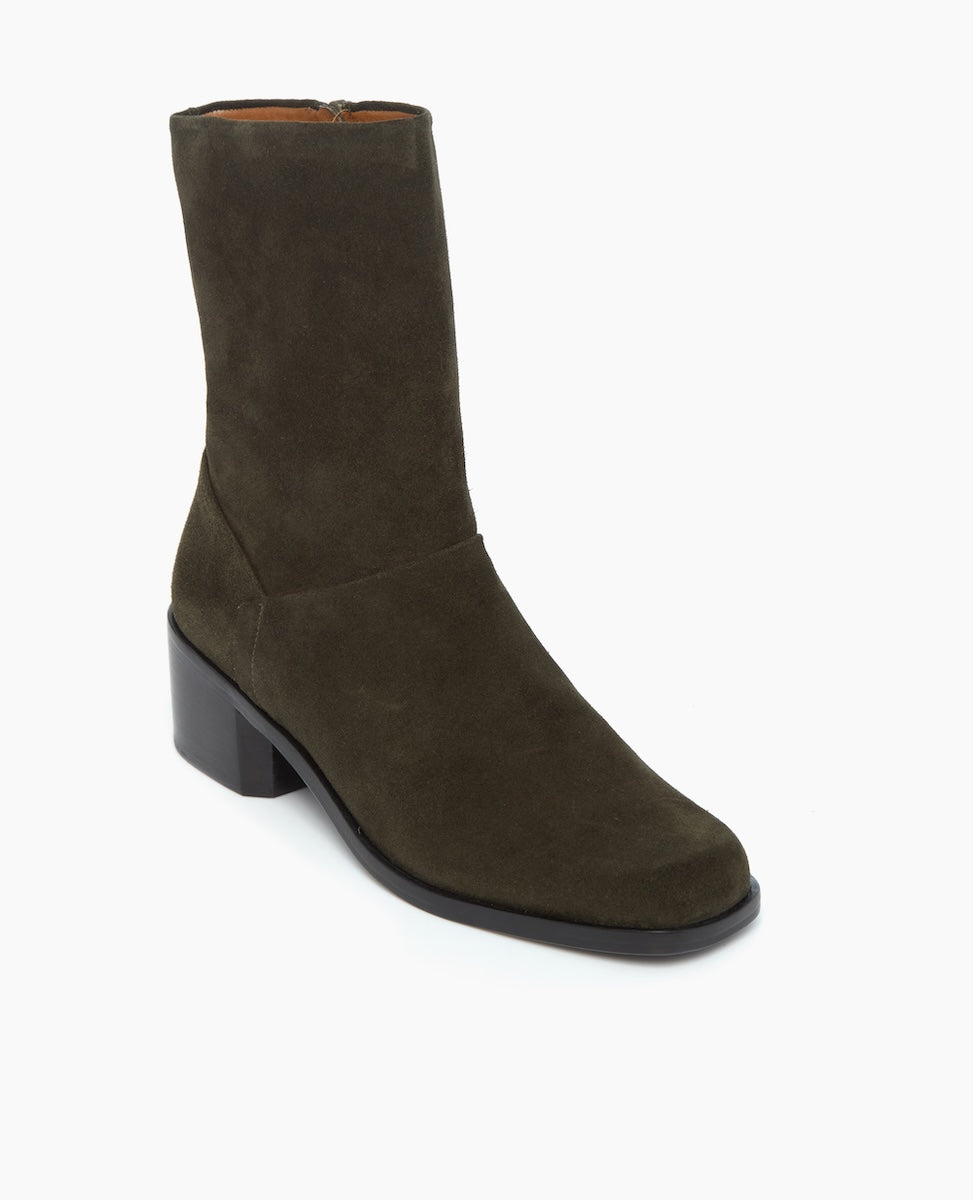 A mid-calf, dark olive green suede boot with a block heel, side zipper, and smooth, matte finish.