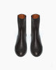 Coclico Celeste Boot displayed from the front: a sleek, mid-heel Chelsea boot with black leather-covered gore. 3