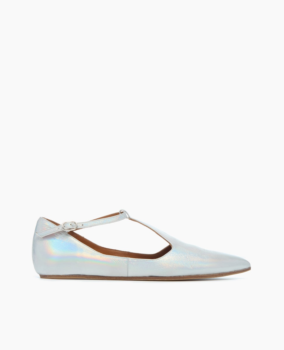 A sleek, iridescent silver flat shoe with a pointed toe, thin ankle strap, and smooth, glossy texture.