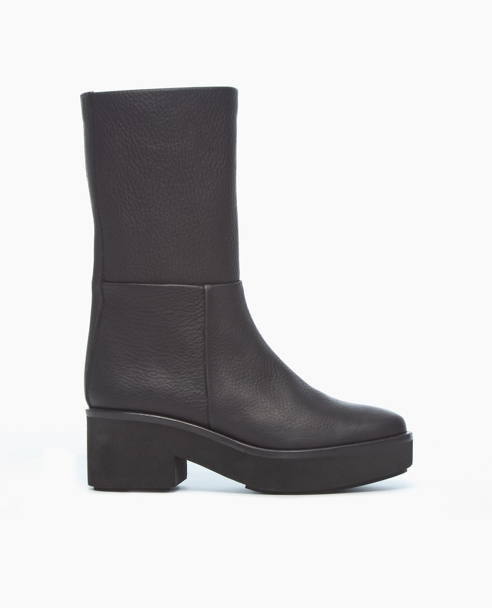 A black, mid-calf leather boot with a smooth, matte finish, featuring a chunky block heel and a slightly rounded toe.