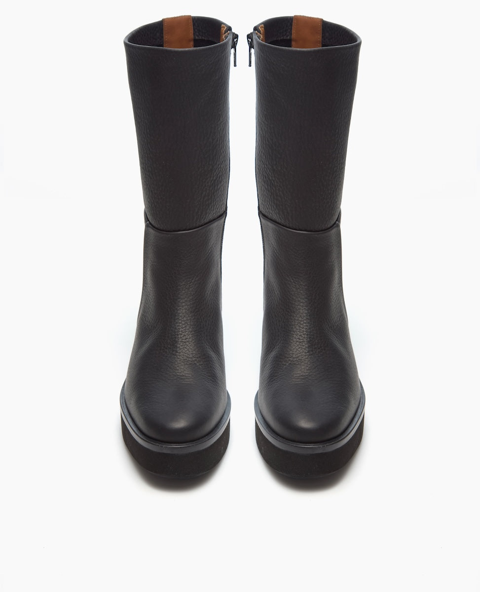 A pair of black, mid-calf leather boots with a smooth, slightly textured finish, featuring a round toe, side zippers, and a thick, sturdy sole.