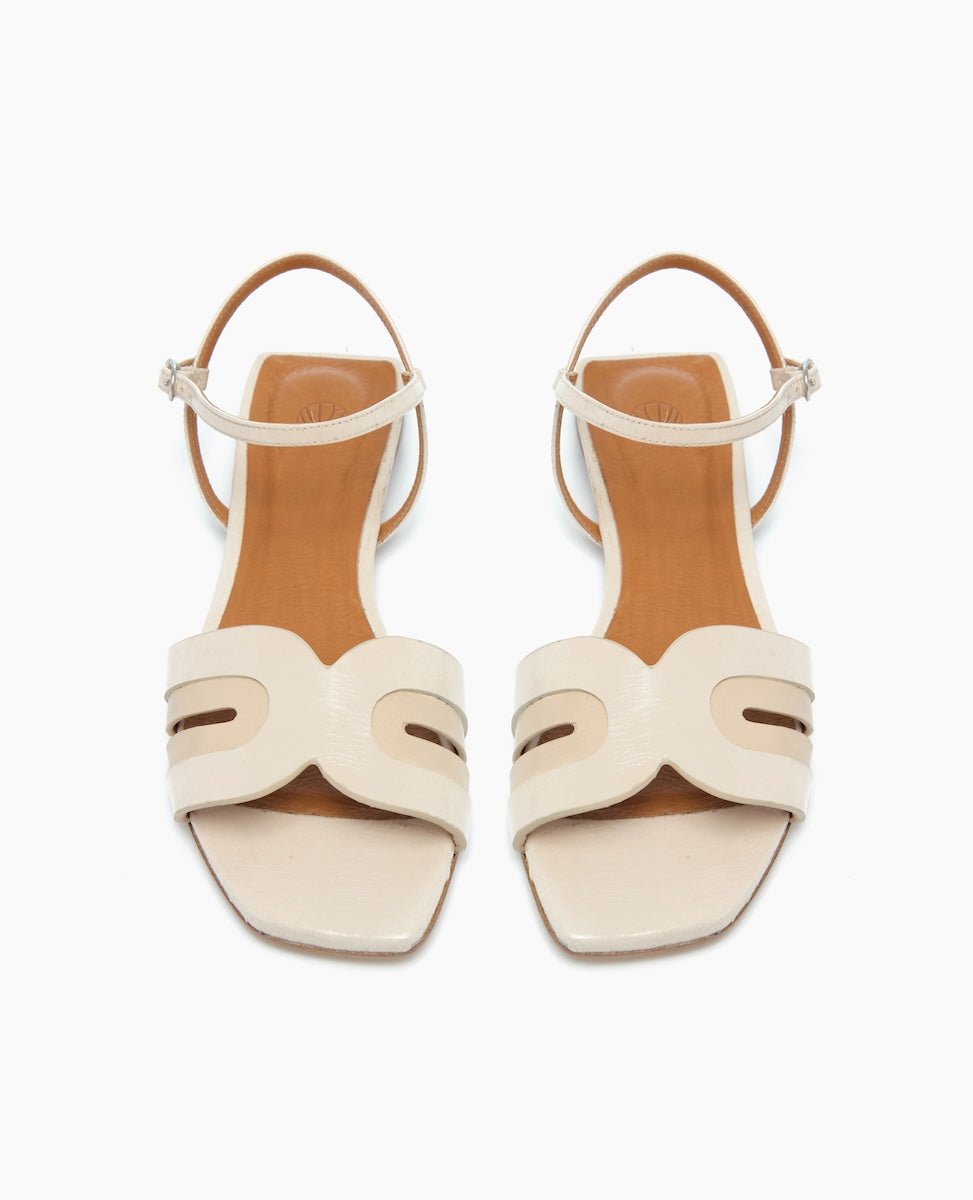 White Sandals with arched strap and buckle closure