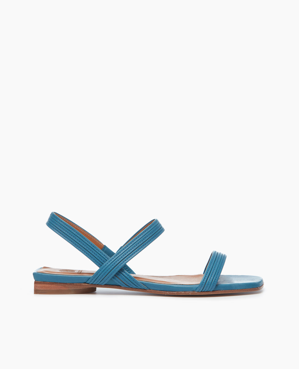 Side view of the Fifi Sandal with a 10mm sandal, leather sole and barely there string like straps.