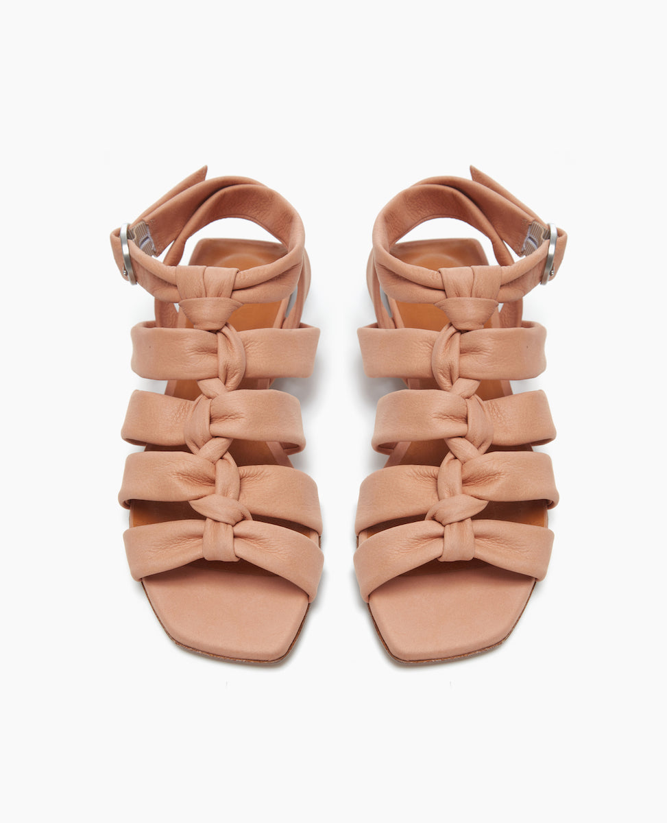 Front view of the Gladiator Sandal in Fawn, featuring the softest, tubular leather straps that twist upward and are paired perfectly with the strenght of the squared-off toe and heel.