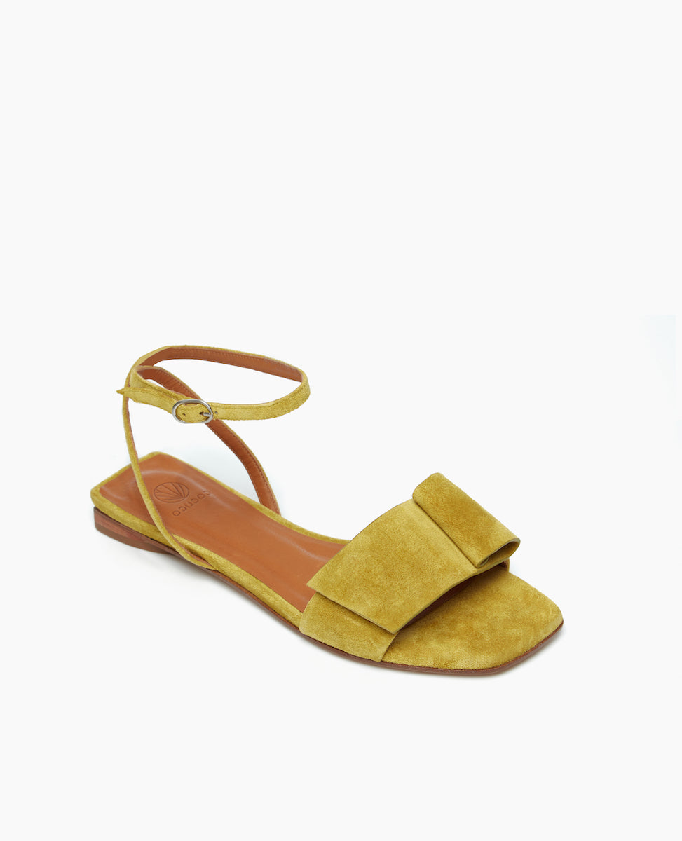 Angled view of the Frances Sandal in Certosa with an architectural loop and fastened at the ankle with a slim strap and buckle closure. Squared-off toe and heel for a crisp, modern look.