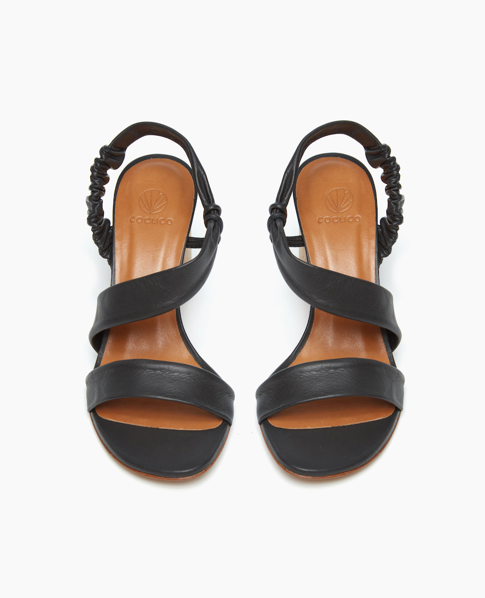 Front view of the Gabby Heel in Deep Sea featuring soft, tubular straps that mold to the foot and sculpted heel from solid Ash wood.