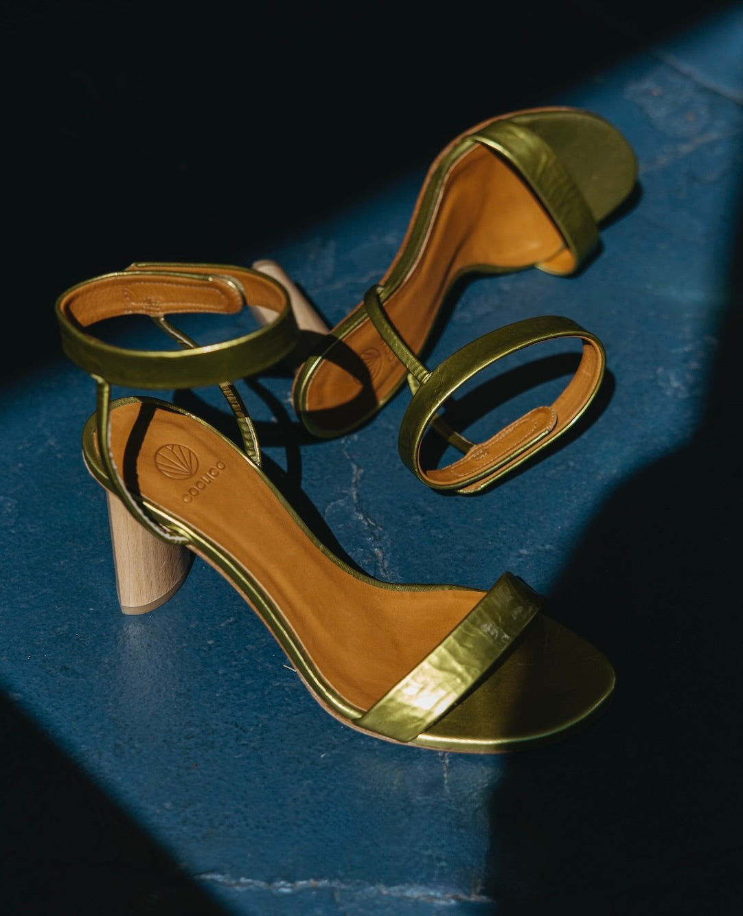 Top view of the Gina Heel in Chartreause with the left pair placed on its side.