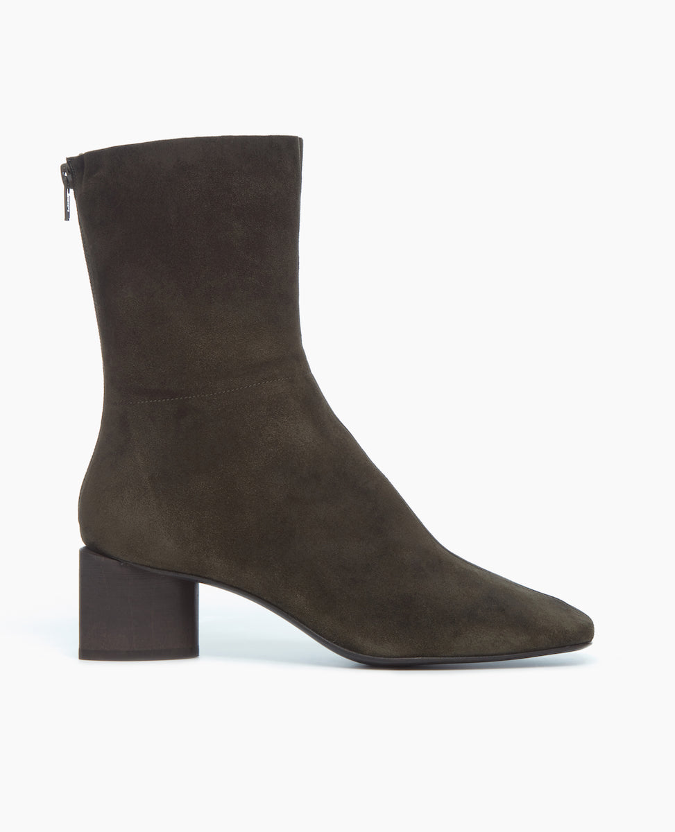 Side view of the Ida Boot in Mimetico split suede: featuring a modern square toe with a higher shaft and solid wood sculptural block 52mm heel.