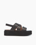 Side view of the Iona Wedge in Black with wide straps and an elasticated slingback. 1