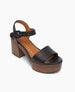 Angled view of the Obion Clog in Black with a platform in ash and midsole in mahogony.   4