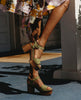 Legs standing outside with the right hand grasping the back strap of the Obion Clog in Mosstone. 6