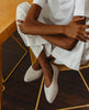 Regal Sneaker in greige on cross legged model 9