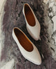 Regal Sneaker in greige from the top on a marble background 8