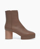 Coclico Travis Boot in Taupe. Side view featuring formed squared toe and balanced with a platform Inside zip closure. 1