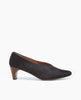 Side view of the Wynne Pump in Black Lux Hair: feature a high-vamped, sweetheart cut that flatters the foot, while a soft chisel-toe and rounded center seam binding detail 1