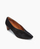 Angled view of the Wynne Pump in Black Lux Hair: feature a high-vamped, sweetheart cut that flatters the foot, while a soft chisel-toe and rounded center seam binding detail 2