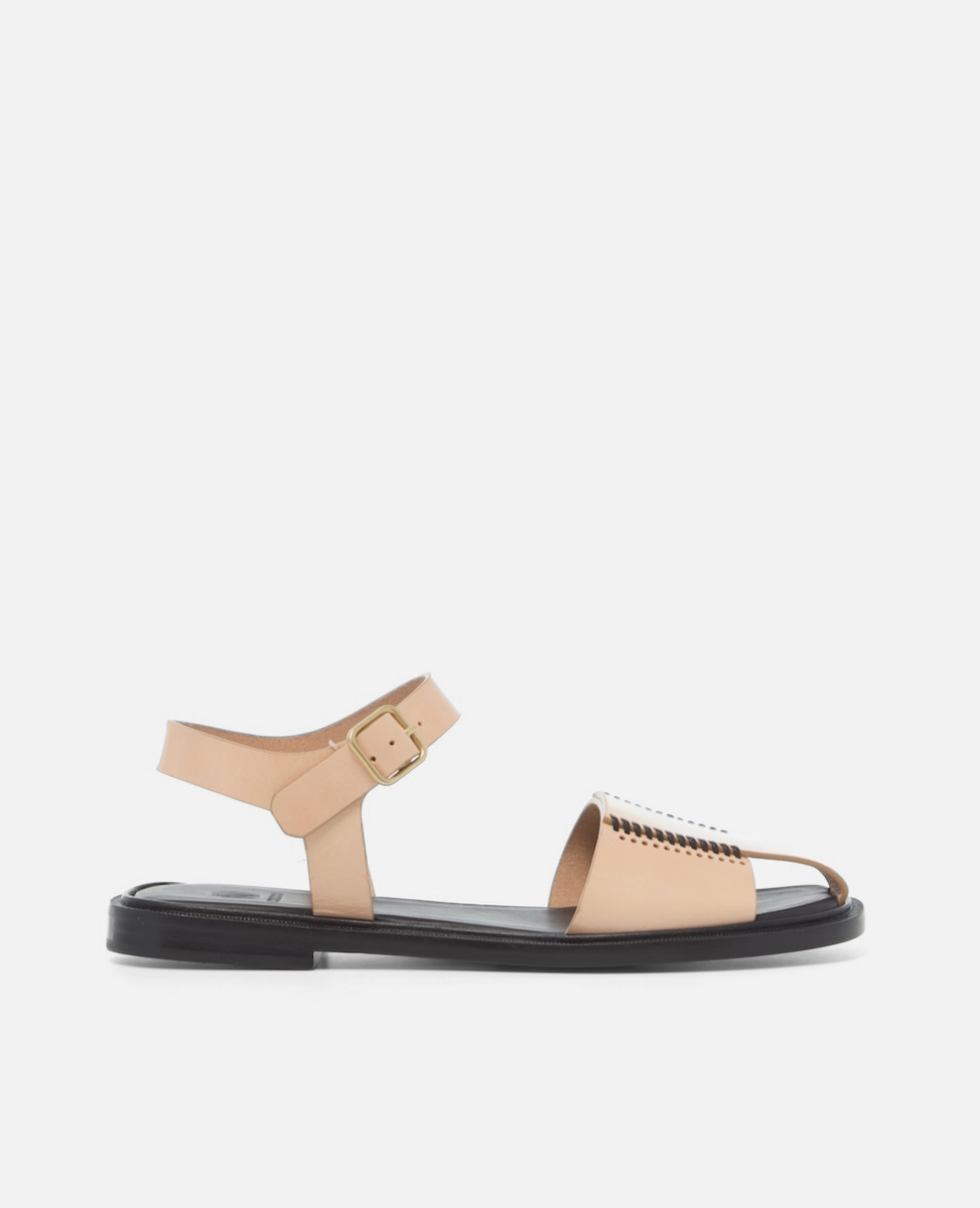 Side view of a natural leather fisherman sandal with stitched banded straps, slim ankle strap, and a black flexible leather sole with textured welt on a white background.