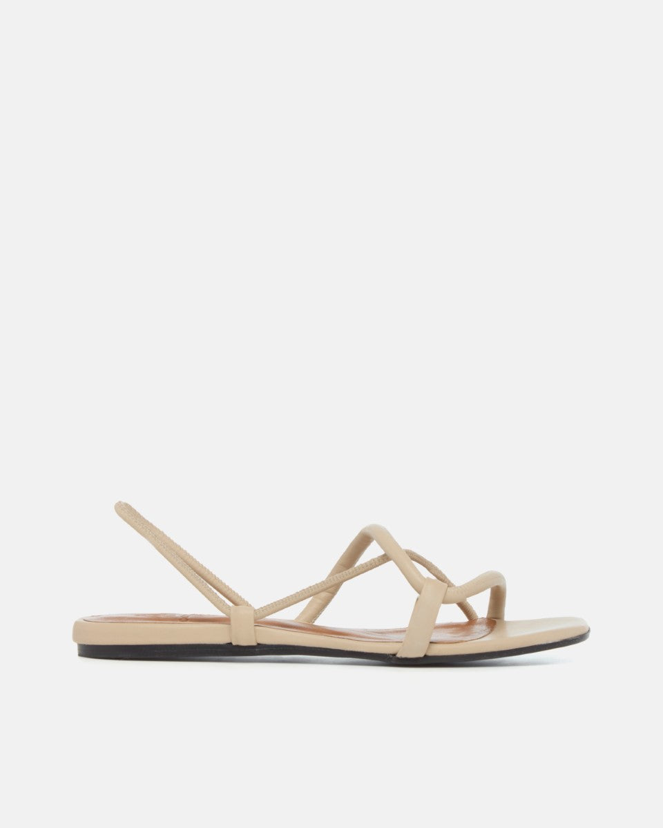 Beige sandal with thin straps on a white background