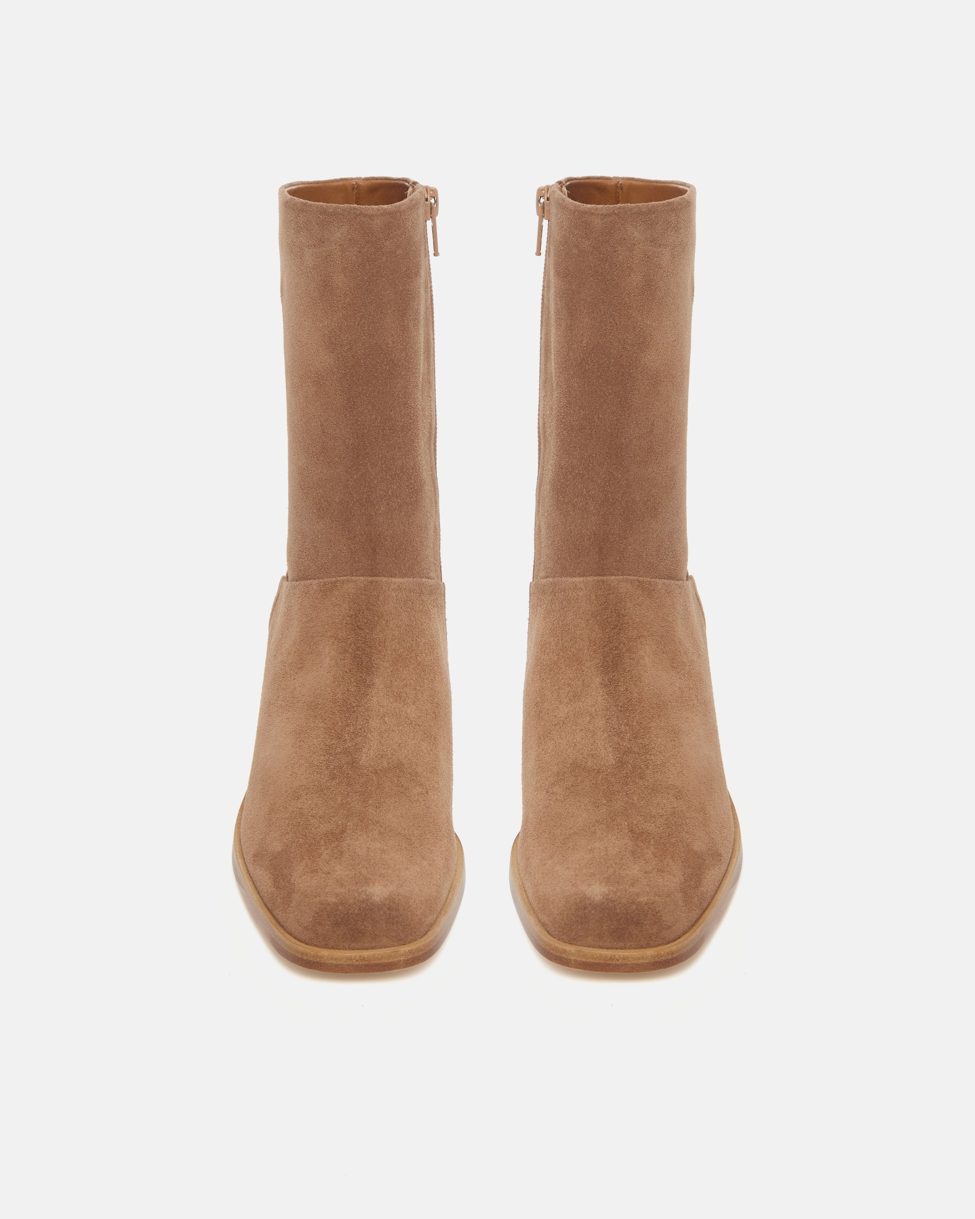 Pair of brown suede ankle boots on a white background