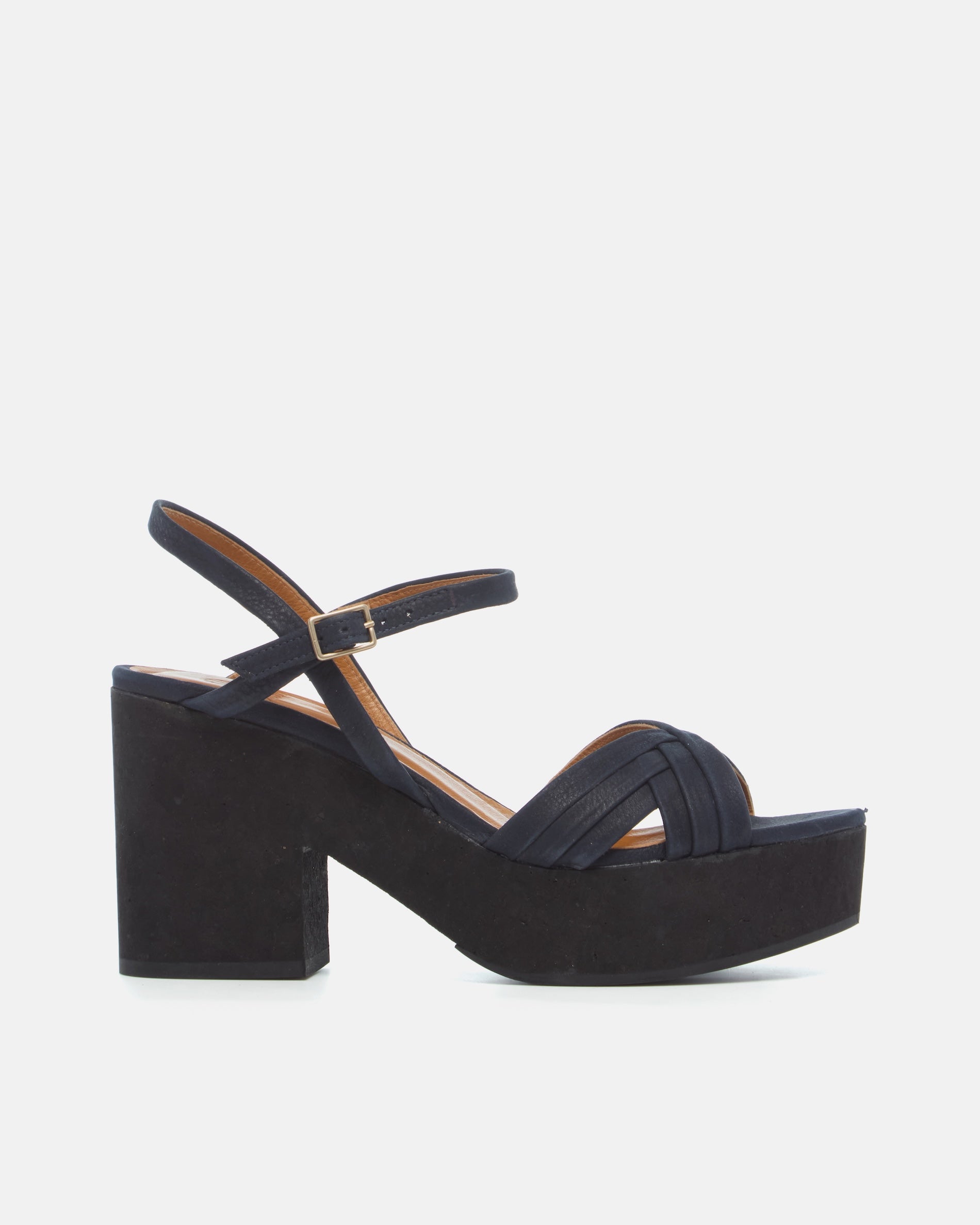 Side view of a navy nubuck leather cork platform sandal with crisscross straps, adjustable ankle strap, and a lightweight cork sole.