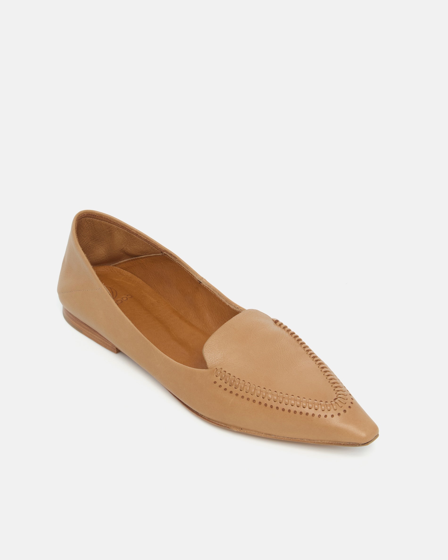 Angled view of a pointed-toe camel leather loafer with topstitch detailing and a flat leather sole on a white background