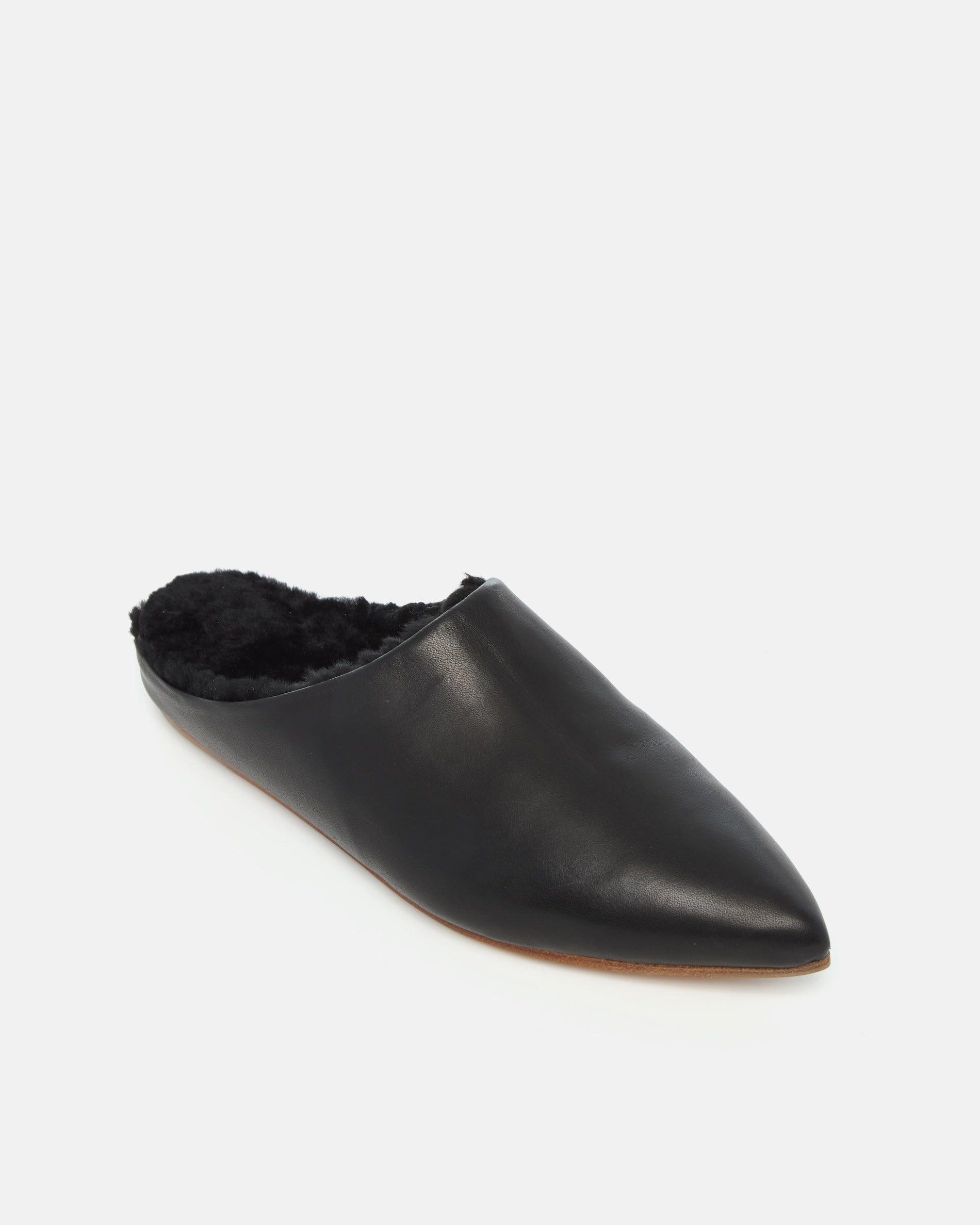 Coclico Dia Shearling Slide in black leather, angled view showing shearling lining