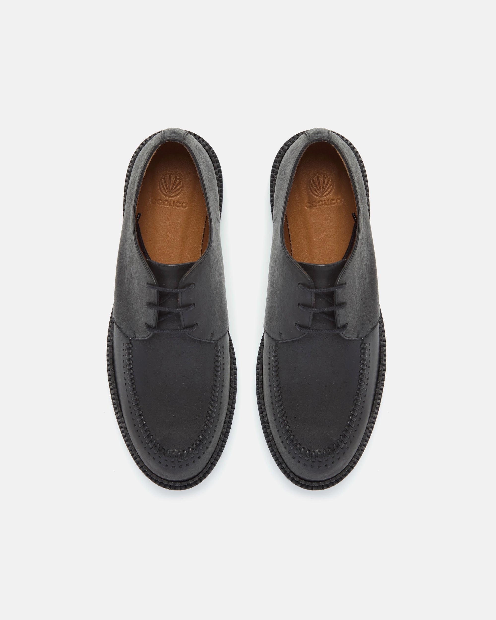 Pair of Coclico Gali Creepers in black leather, top view of lace up moc toe creepers