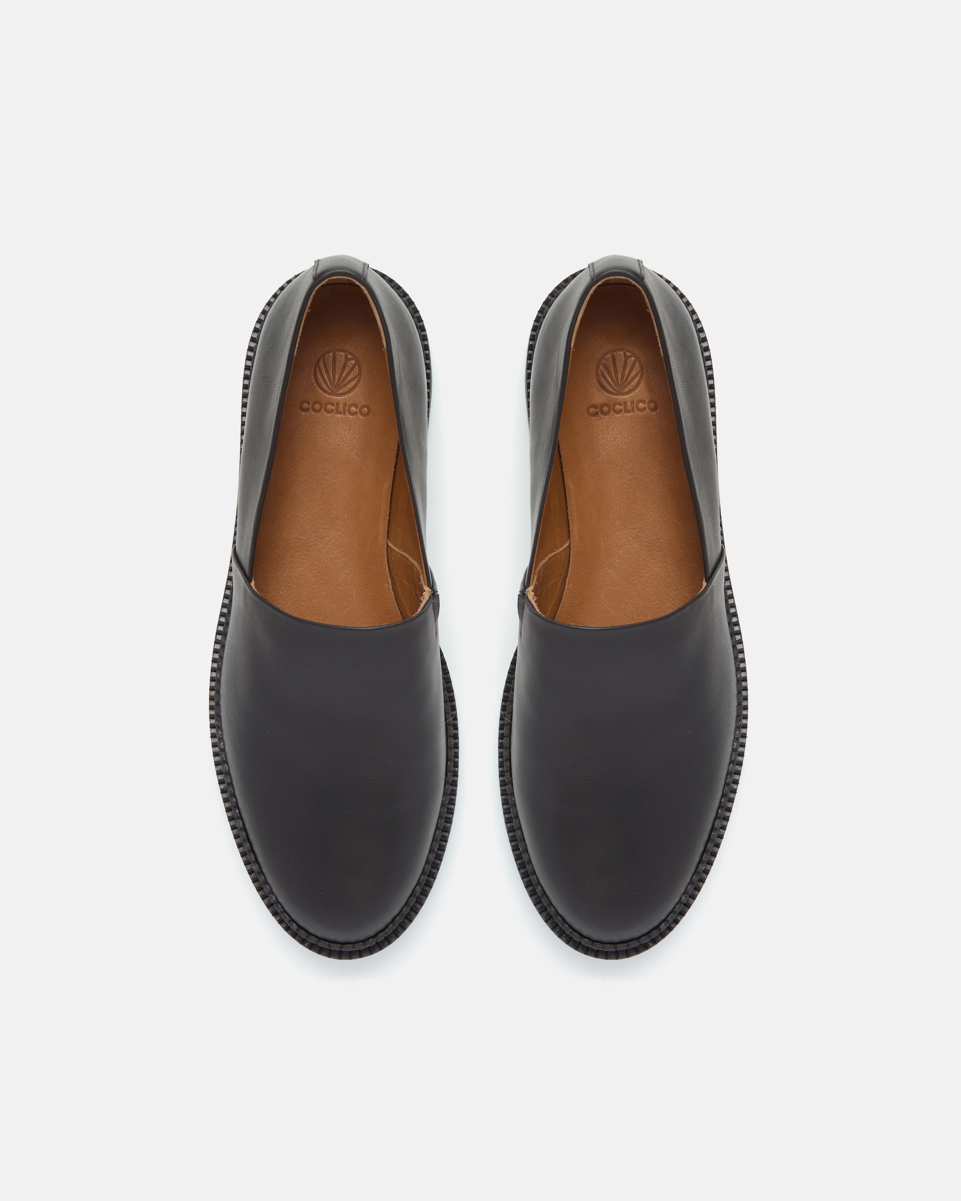 Pair of Coclico Ginsberg Loafers in black leather, top view of flatform slip ons