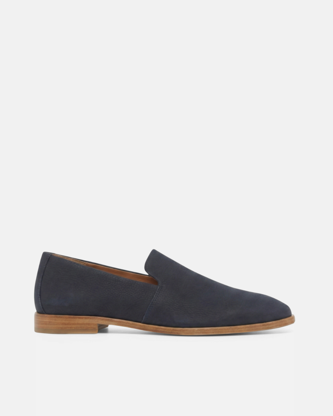 Side view of a navy nubuck leather slip-on loafer with a tapered square toe and low stacked heel on a white background
