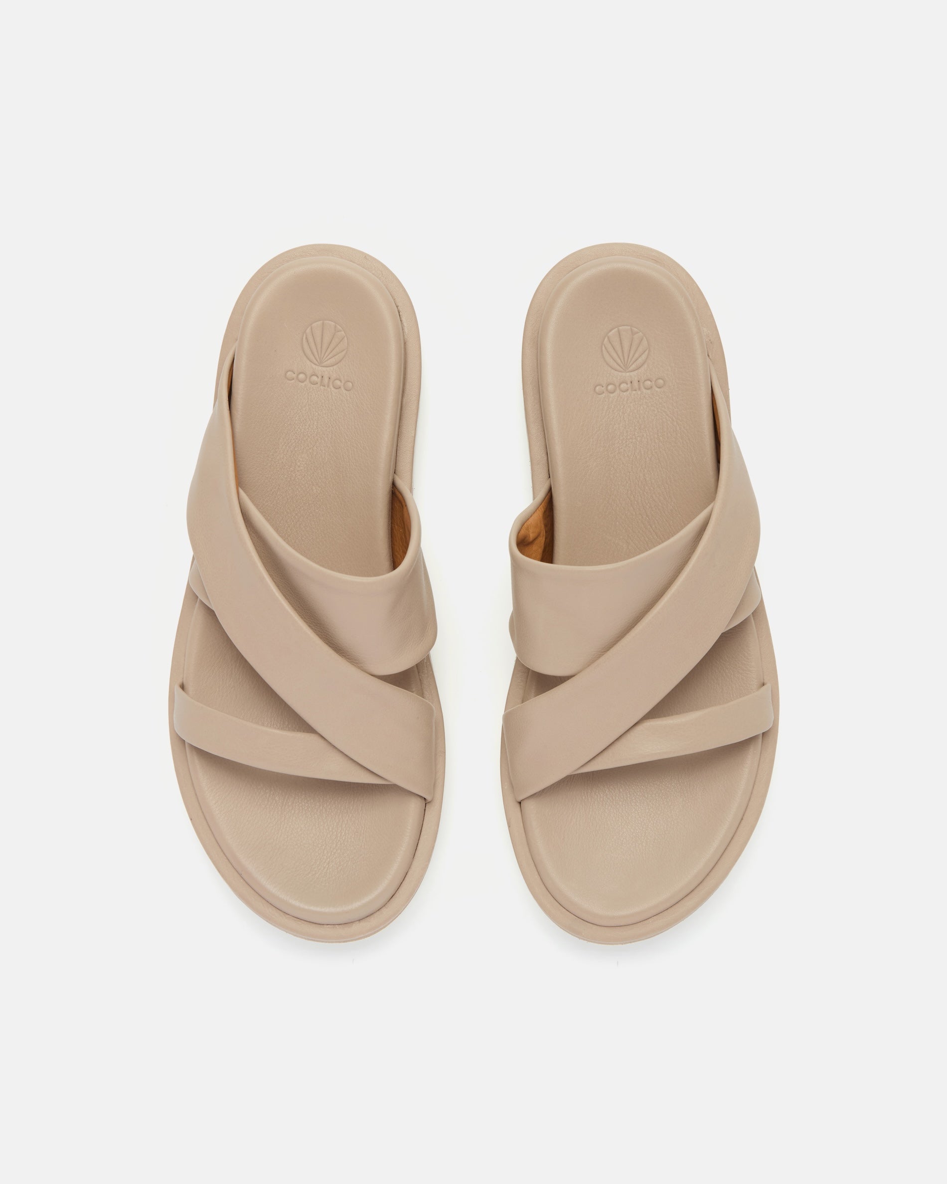 Top view of a grey leather footbed sandal with wide folded straps and a sleek cushioned platform sole