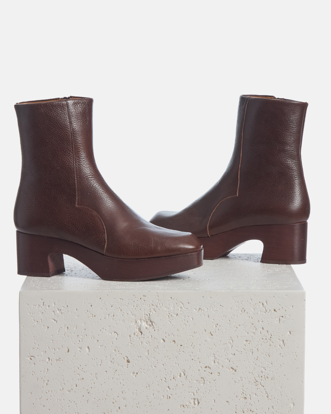 Coclico Quality Clog Boot in Castagno leather, brown clog boots on mahogany platform heels styled on a stone plinth