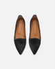 Pair of black pointed-toe shoes with brown leather insoles on a white background 1