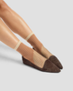 Beige striped socks worn with brown flats on a light gray background 5