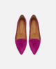 Pair of pink suede shoes with brown soles on a white background 1