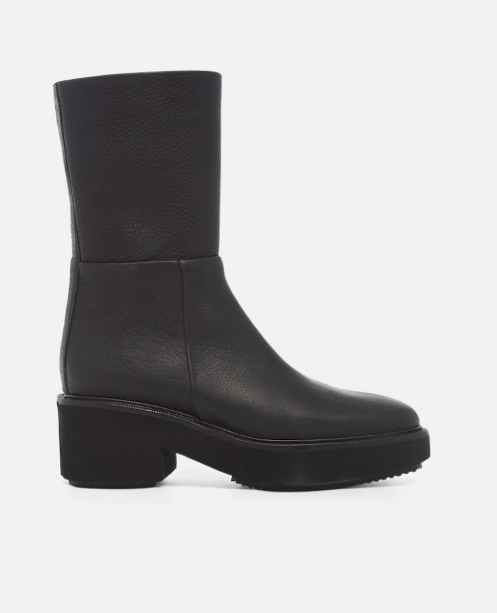 Black leather boot on a white background