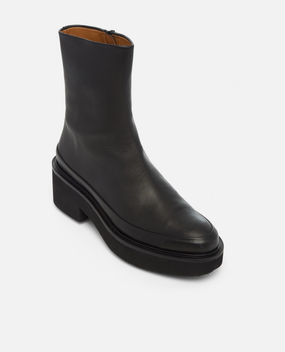 Black leather boot on a white background