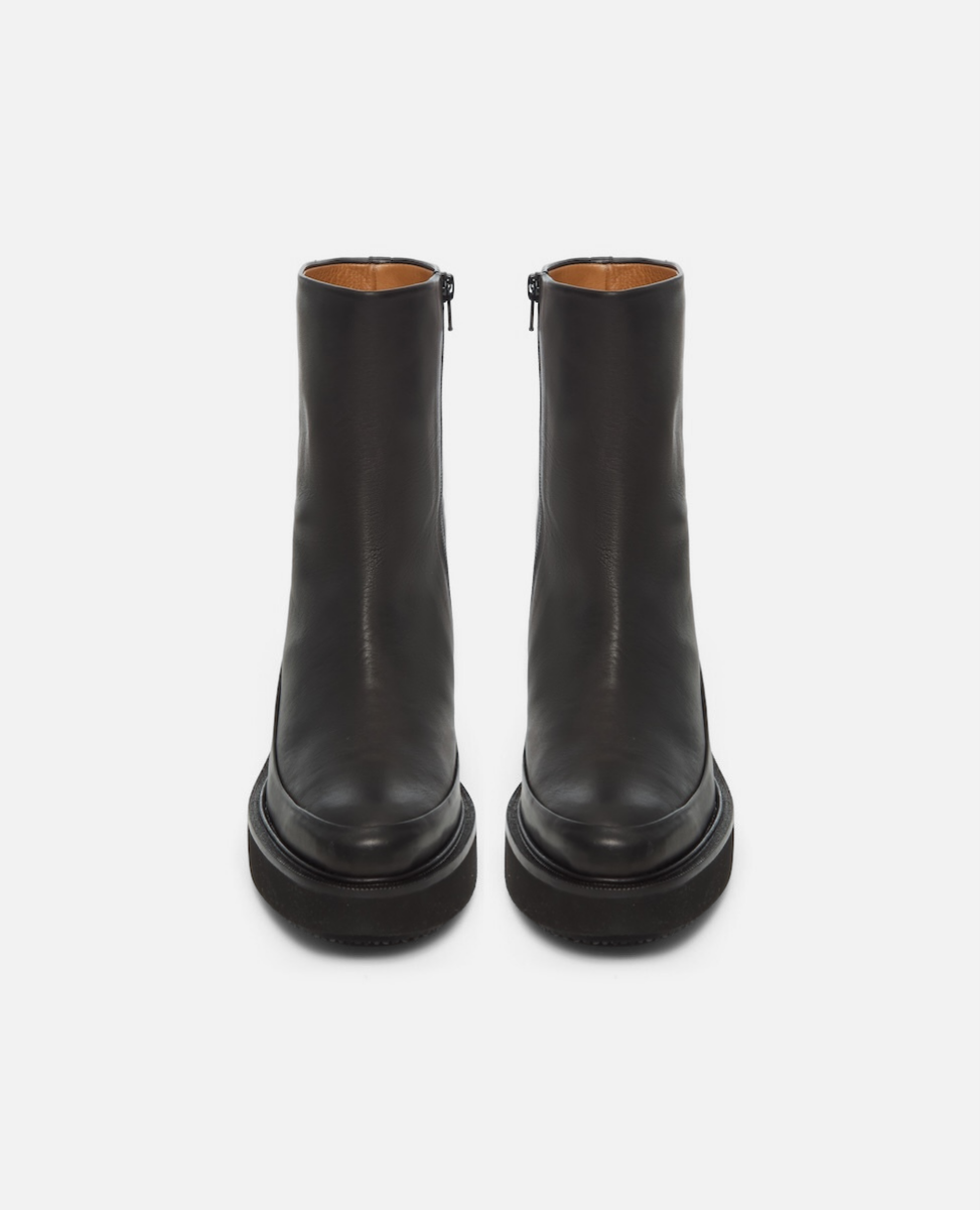 Pair of black ankle boots on a white background